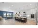 Spacious kitchen with a large center island, white cabinetry, and modern lighting at 8272 Redonda Loop, Bradenton, FL 34202