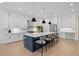 Open kitchen featuring a center island with barstool seating and ample counter space at 8272 Redonda Loop, Bradenton, FL 34202
