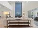 Bright living room with high ceilings, a blue accent wall, modern decor and backyard access at 8272 Redonda Loop, Bradenton, FL 34202