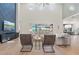 Bright living room with high ceilings, modern decor, and a large sliding glass door at 8272 Redonda Loop, Bradenton, FL 34202