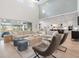 Bright, open living room with soaring ceilings, backyard access, and an adjacent kitchen area at 8272 Redonda Loop, Bradenton, FL 34202