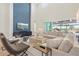 Stylish living room features high ceilings, statement wall, and a large comfortable sectional sofa at 8272 Redonda Loop, Bradenton, FL 34202
