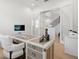 Home office with hardwood floors, and adjacent to the main stairs leading to the second floor at 8272 Redonda Loop, Bradenton, FL 34202