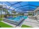 Beautiful screened in pool area with luxurious lounge seating and spa-like features at 8272 Redonda Loop, Bradenton, FL 34202