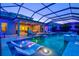 Beautiful screened-in pool and patio featuring built-in lounge chairs and outdoor seating area at 8272 Redonda Loop, Bradenton, FL 34202
