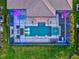 Aerial perspective of a luxurious pool and spa area enclosed within a screened lanai at 8272 Redonda Loop, Bradenton, FL 34202