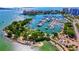 Aerial view of a waterfront with yachts, greenery and city landscape in the background at 8272 Redonda Loop, Bradenton, FL 34202