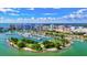 Aerial view of Sarasota's waterfront area, showcasing a marina filled with boats against the city skyline at 8272 Redonda Loop, Bradenton, FL 34202