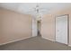 This bedroom features neutral carpet, light pink painted walls, and double door closet at 860 Virginia St # 304, Dunedin, FL 34698