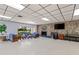 Cozy community room with comfortable seating, fireplace, and TV area, creating a welcoming gathering space at 860 Virginia St # 304, Dunedin, FL 34698
