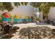 Charming courtyard with seating areas and a colorful mural, offering a pleasant outdoor space at 860 Virginia St # 304, Dunedin, FL 34698