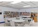 Well-stocked library with tables and chairs, providing a quiet and inviting space for reading and studying at 860 Virginia St # 304, Dunedin, FL 34698