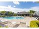 Community pool area includes lounge chairs, a covered pavilion, and well-maintained landscaping at 8628 Milestone Dr, Sarasota, FL 34238
