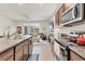 Modern kitchen with granite countertops, stainless steel appliances and an open layout at 8628 Milestone Dr, Sarasota, FL 34238