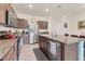 Spacious kitchen with stainless steel appliances, granite countertops and large center island for food preparation at 8628 Milestone Dr, Sarasota, FL 34238