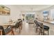 Open concept living area, dining area and kitchen provide a spacious and airy feel to the home at 8628 Milestone Dr, Sarasota, FL 34238