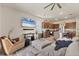 Open living area seamlessly connecting the living room to the kitchen, perfect for entertaining at 8628 Milestone Dr, Sarasota, FL 34238