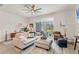 Inviting living room with a comfortable sofa, stylish decor, and views of the outdoors at 8628 Milestone Dr, Sarasota, FL 34238