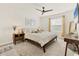 Main bedroom with neutral walls, carpeted floors, and ensuite bathroom at 8628 Milestone Dr, Sarasota, FL 34238