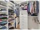 Well-organized walk-in closet with shelving and rods at 8628 Milestone Dr, Sarasota, FL 34238