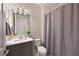 Bathroom featuring a vanity with bright lighting and a gray shower curtain at 8916 Isabella Cir, Parrish, FL 34219