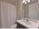 Cozy bathroom with vanity and shower featuring a white shower curtain at 8916 Isabella Cir, Parrish, FL 34219