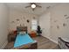 Quaint bedroom featuring hardwood floors, neutral walls, and a unique Star Wars theme at 8916 Isabella Cir, Parrish, FL 34219