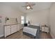Comfortable bedroom featuring hardwood floors, neutral walls and natural light at 8916 Isabella Cir, Parrish, FL 34219