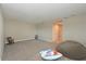 Large bonus room with carpeted floors, and comfortable beanbag chair at 8916 Isabella Cir, Parrish, FL 34219