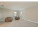 Spacious bonus room with two beanbag chairs, and carpeted floors at 8916 Isabella Cir, Parrish, FL 34219