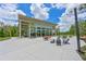 Bright community clubhouse with expansive windows and outdoor seating areas at 8916 Isabella Cir, Parrish, FL 34219