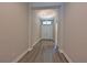 Inviting entry hall with hardwood floors and neutral paint that complements the bright space at 8916 Isabella Cir, Parrish, FL 34219