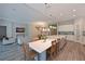Open-concept kitchen featuring an island with seating and stainless steel appliances at 8916 Isabella Cir, Parrish, FL 34219
