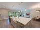 Bright kitchen with a large island, stainless steel appliances, custom cabinets, and an open floor plan at 8916 Isabella Cir, Parrish, FL 34219