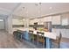 Spacious kitchen features large island with seating, custom cabinetry, stainless steel appliances, and pendant lights at 8916 Isabella Cir, Parrish, FL 34219