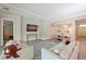 Well lit living room featuring hardwood floors, neutral walls, crown moulding, and a dining table at 8916 Isabella Cir, Parrish, FL 34219