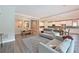 Spacious open living and dining area with hardwood floors, crown moulding, and lots of natural light at 8916 Isabella Cir, Parrish, FL 34219