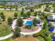 Community playground with shade and play equipment, set in a park-like setting among well-maintained homes at 8916 Isabella Cir, Parrish, FL 34219