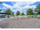 Swings and colorful playground features, offering a vibrant and safe environment for to play outdoors at 8916 Isabella Cir, Parrish, FL 34219