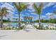 Resort-style community pool featuring a water slide and ample lounge seating at 8916 Isabella Cir, Parrish, FL 34219