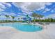 Spacious community pool features a water slide, palm trees, and lounge chairs at 8916 Isabella Cir, Parrish, FL 34219