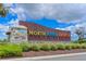 Welcoming North River Ranch community sign with stone base and colorful lettering at 8916 Isabella Cir, Parrish, FL 34219