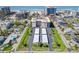 An aerial view of a condo complex near the beach, showcasing a covered parking area and well-maintained green spaces at 1001 Benjamin Franklin Dr # 106, Sarasota, FL 34236