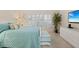 Bright bedroom with natural light, plantation shutters, comfortable bed, and plenty of storage at 1001 Benjamin Franklin Dr # 106, Sarasota, FL 34236