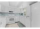 The kitchen showcases sleek countertops and modern appliances for a delightful cooking experience at 1001 Benjamin Franklin Dr # 106, Sarasota, FL 34236