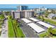 Exterior image of the property showing the parking lot with covered parking spaces at 1001 Benjamin Franklin Dr # 106, Sarasota, FL 34236