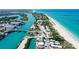 Breathtaking aerial view captures the coastline, inlet, and beaches, showing the coastal landscape at 105 Casey Key Rd # 20, Nokomis, FL 34275