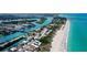 Expansive aerial view of the coastline, inlet, and beaches, highlighting the coastal community at 105 Casey Key Rd # 20, Nokomis, FL 34275