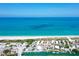 Stunning aerial view showcases beachfront homes along the coast with clear ocean views at 105 Casey Key Rd # 20, Nokomis, FL 34275