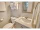 Cozy bathroom featuring a modern vanity with marble countertop and a mirrored wall cabinet at 105 Casey Key Rd # 20, Nokomis, FL 34275